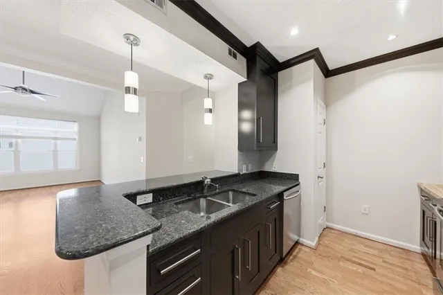 a kitchen with a sink and cabinets