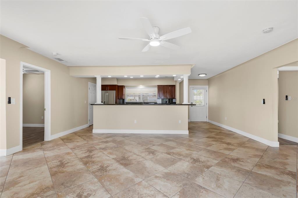 708 Sunset Cove Madeira Beach, FL 33708 - Photo 17 of 61 an empty room with kitchen view and a window