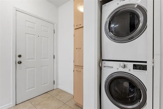 a view of a hallway with washer and dryer