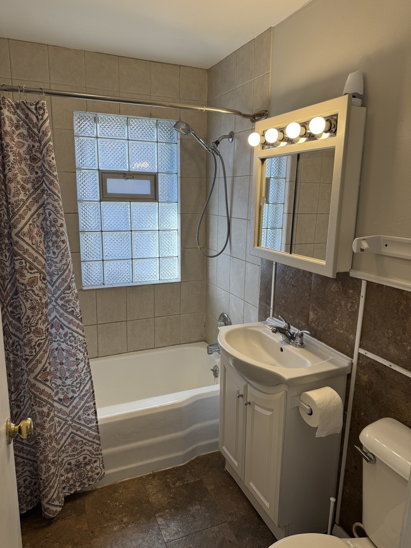 1111 Lincoln Street, Unit 2 Lockport, IL 60441 - Photo 12 of 23 a bathroom with a sink toilet and shower