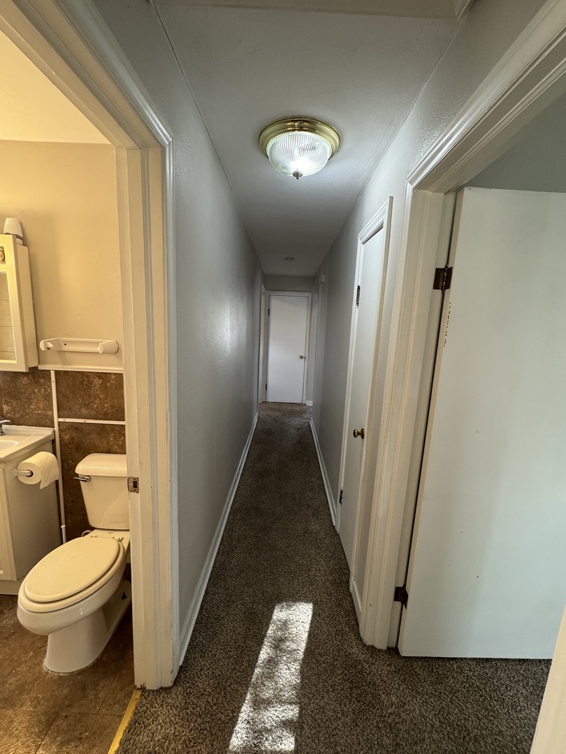 1111 Lincoln Street, Unit 2 Lockport, IL 60441 - Photo 14 of 23 a bathroom with a toilet and a shower