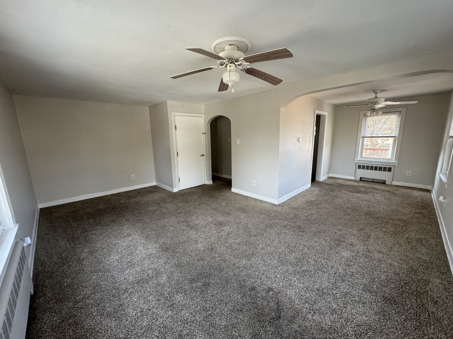 1111 Lincoln Street, Unit 2 Lockport, IL 60441 - Photo 6 of 23 a view of a livingroom with a ceiling fan and window