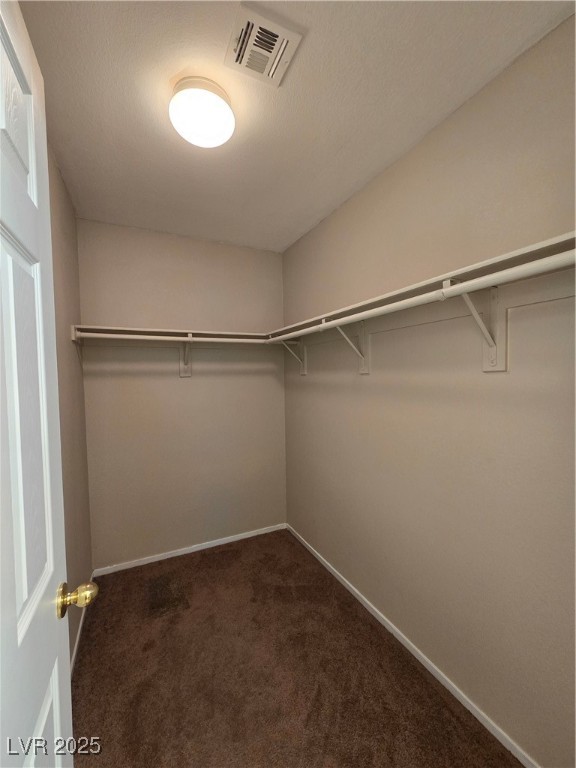 9560 Parker Springs Court Las Vegas, NV 89166 - Photo 22 of 37 Spacious closet with dark colored carpet