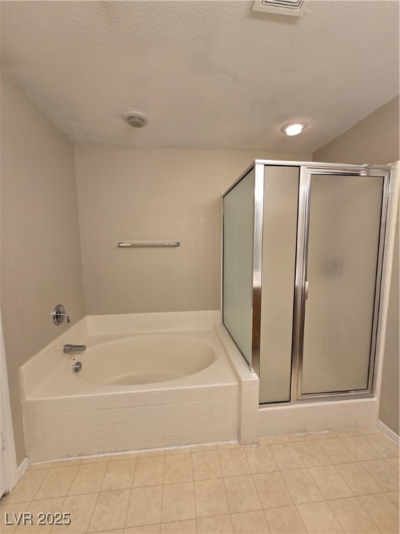 9560 Parker Springs Court Las Vegas, NV 89166 - Photo 24 of 37 Full bathroom featuring a shower stall, a bath, a textured ceiling, and light tile patterned floors