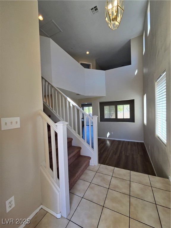 9560 Parker Springs Court Las Vegas, NV 89166 - Photo 3 of 37 Stairway with a high ceiling and tile patterned floors
