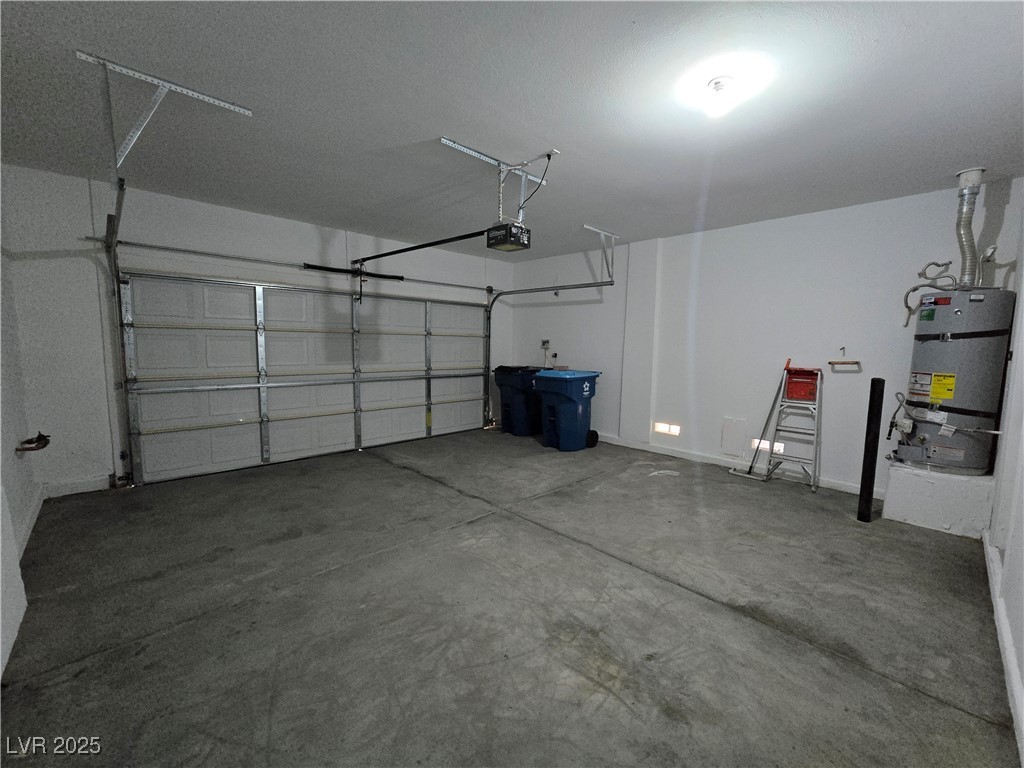 9560 Parker Springs Court Las Vegas, NV 89166 - Photo 32 of 37 Garage featuring strapped water heater and a garage door opener