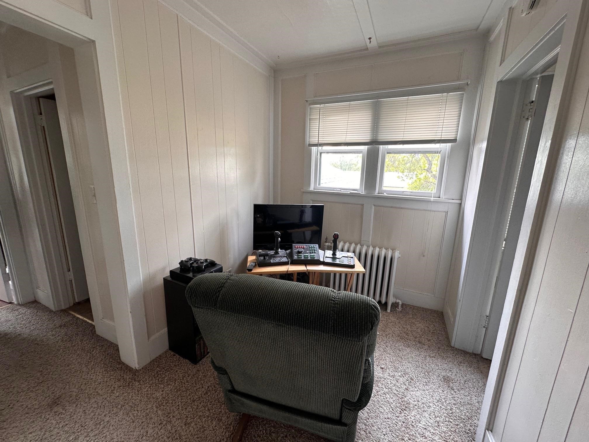 1601 4th Avenue International Falls, MN 56649 - Photo 28 of 50 Office space featuring radiator, light colored carpet, ornamental molding, and wood walls