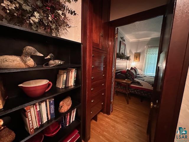 1601 4th Avenue International Falls, MN 56649 - Photo 39 of 50 Hallway featuring light wood finished floors and ornamental molding