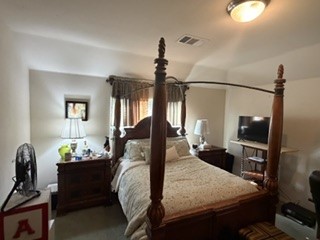 6720 Cromarty Lane Austin, TX 78754 - Photo 22 of 24 Relax in this well-lit bedroom, featuring a traditional four-poster bed and ample space.