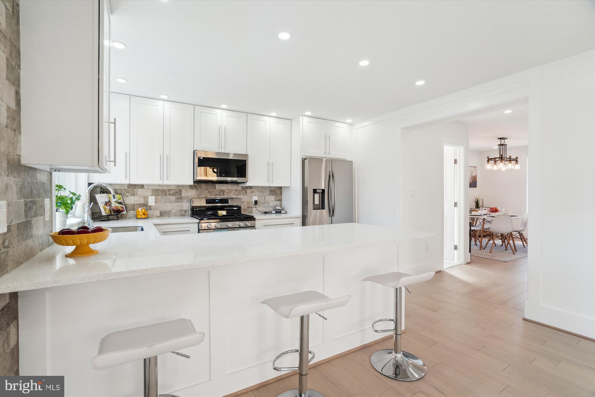 10011 Sidney Road Silver Spring, MD 20901 - Photo 12 of 35 a kitchen with stainless steel appliances granite countertop a refrigerator and a stove top oven