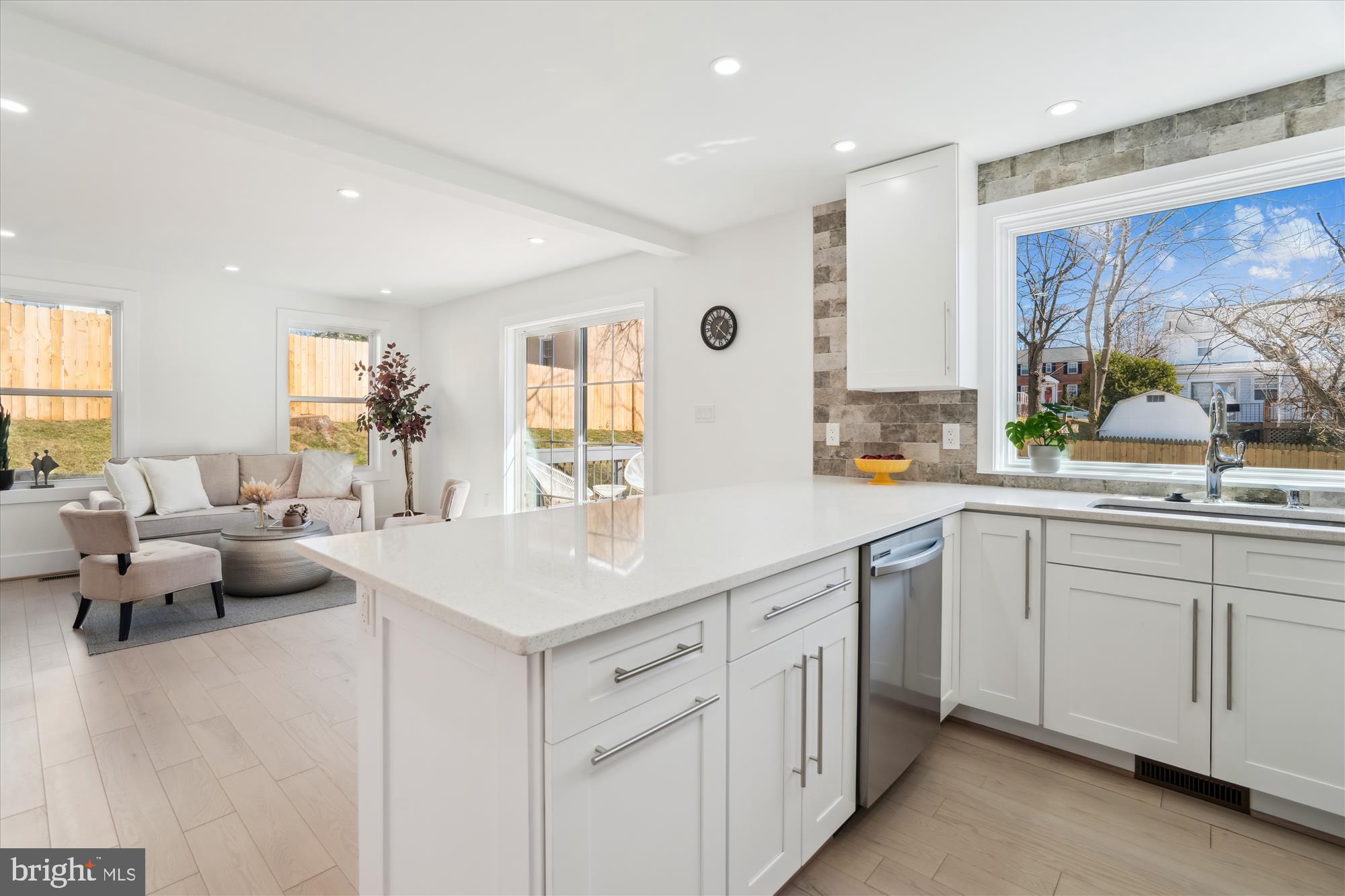 10011 Sidney Road Silver Spring, MD 20901 - Photo 13 of 35 a kitchen with counter top space sink and living room