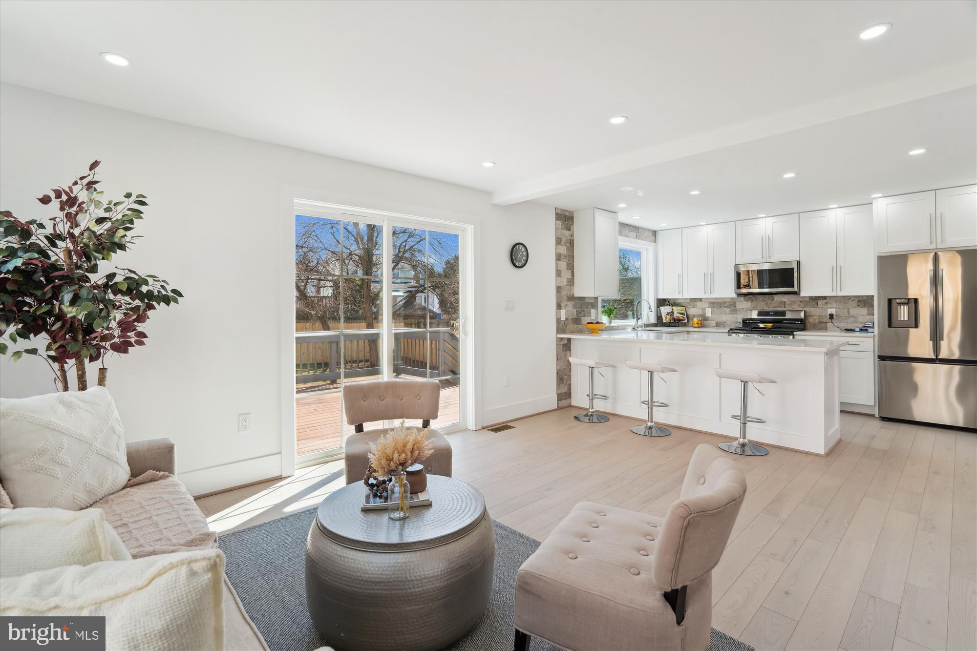 10011 Sidney Road Silver Spring, MD 20901 - Photo 14 of 35 a living room with furniture potted plant and kitchen view