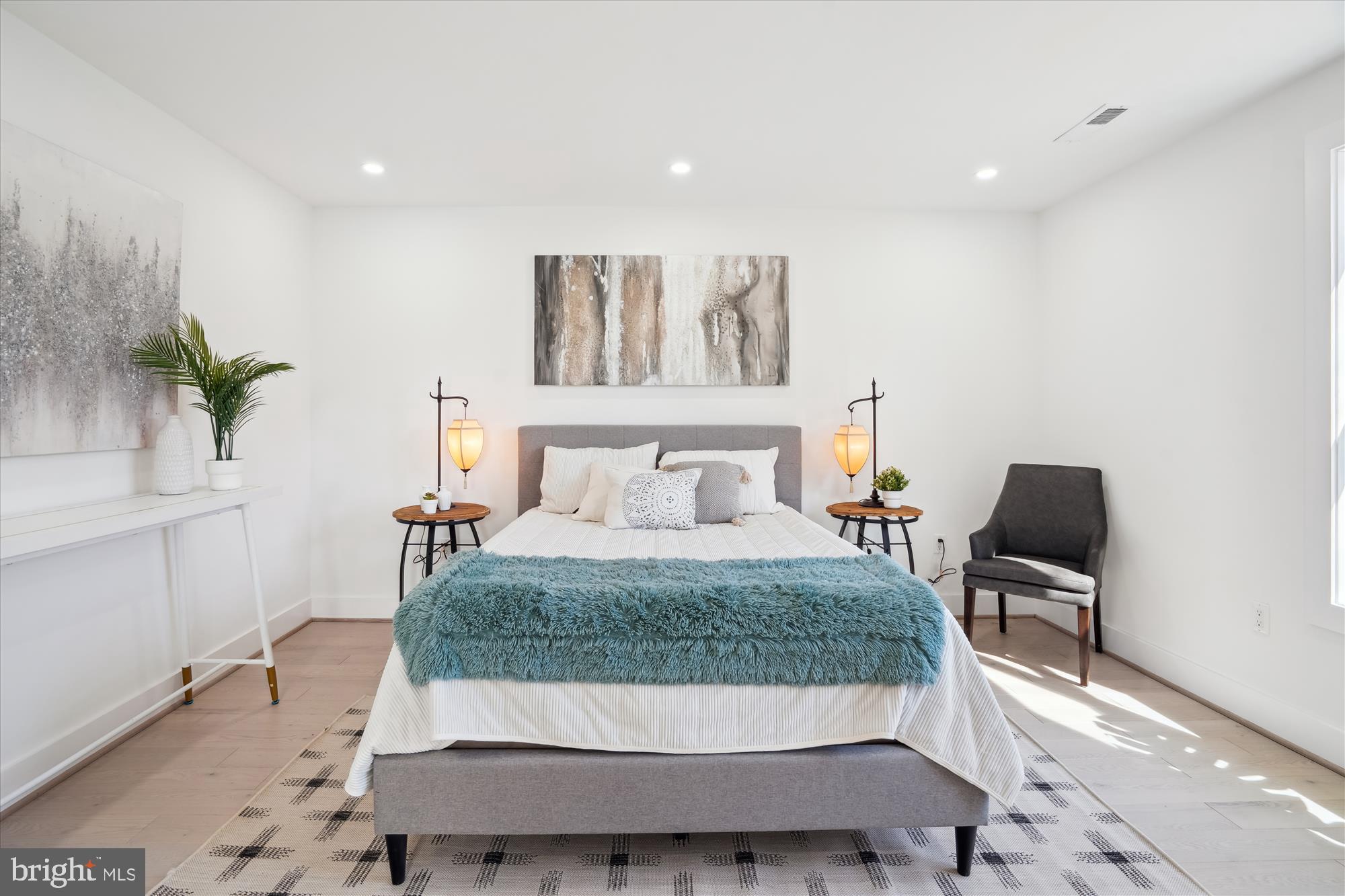 10011 Sidney Road Silver Spring, MD 20901 - Photo 21 of 35 a bedroom with a bed and a potted plant
