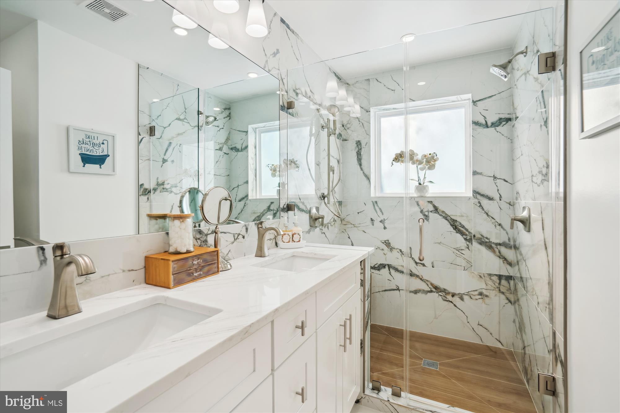 10011 Sidney Road Silver Spring, MD 20901 - Photo 23 of 35 a bathroom with a double vanity sink mirror and shower