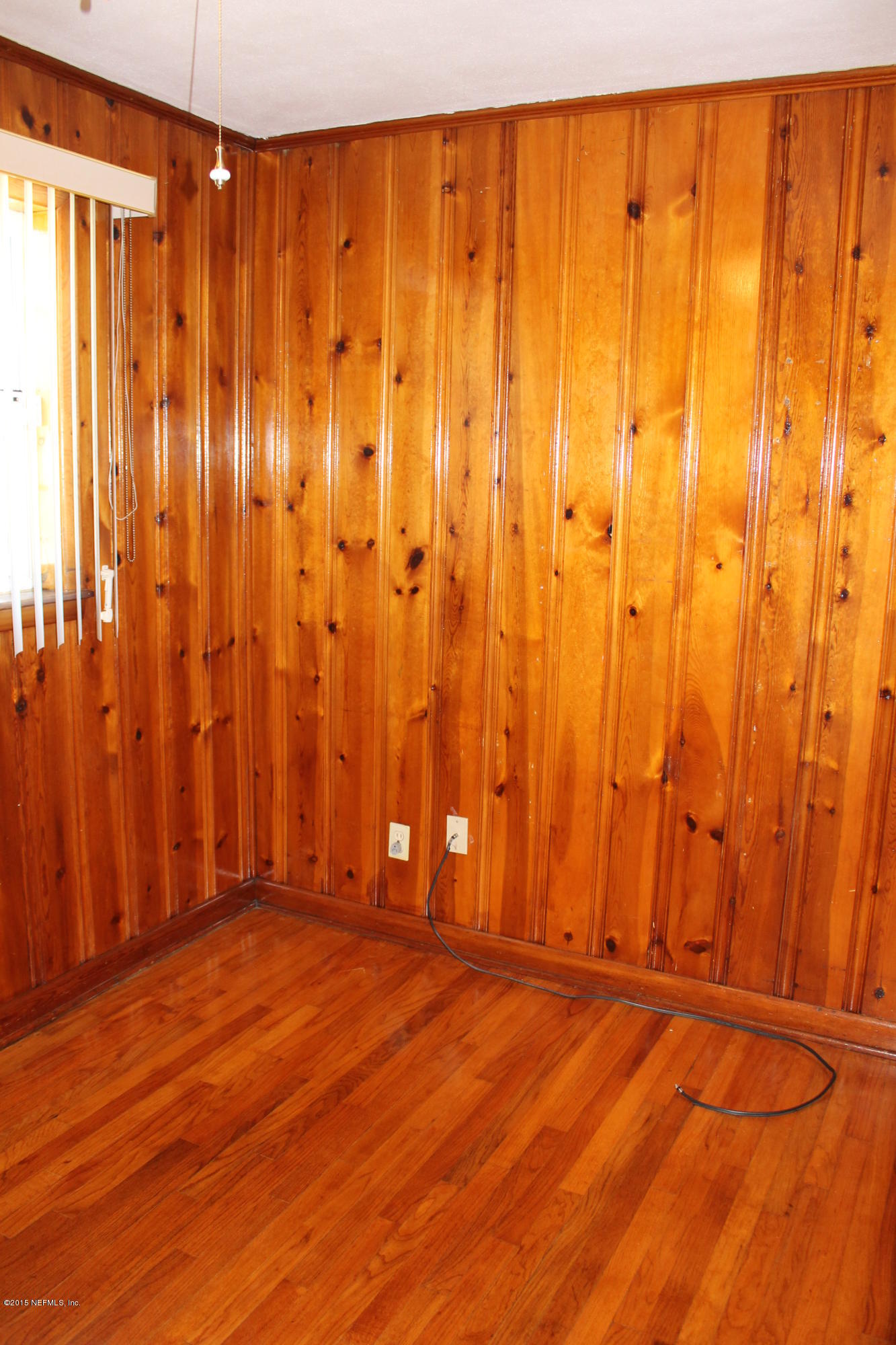 3504 Rogero Road Jacksonville, FL 32277 - Photo 31 of 38 a view of a room with wooden walls