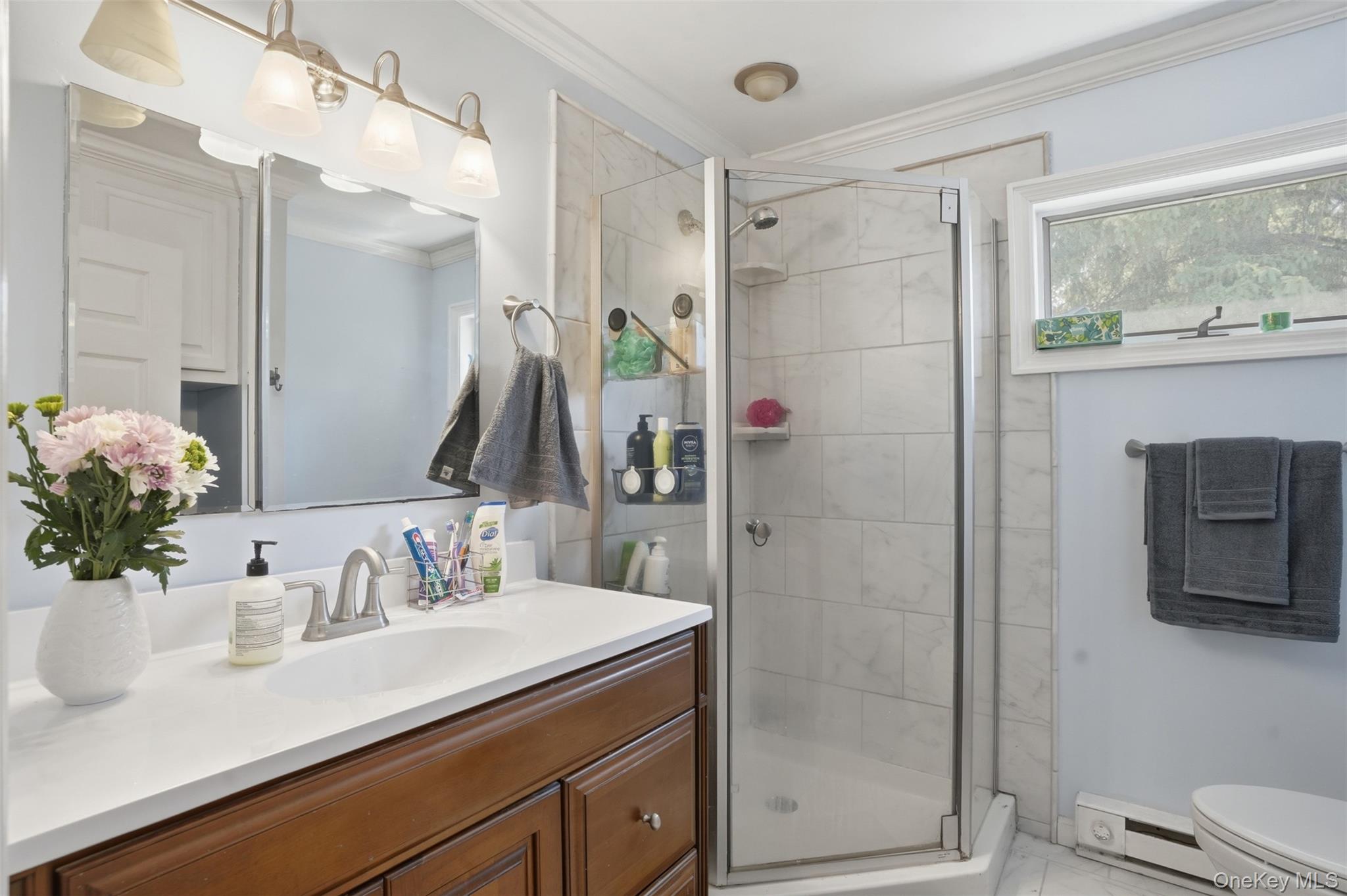 147 County Rte 1 Warwick, NY 10990 - Photo 22 of 45 a bathroom with a shower sink vanity and mirror