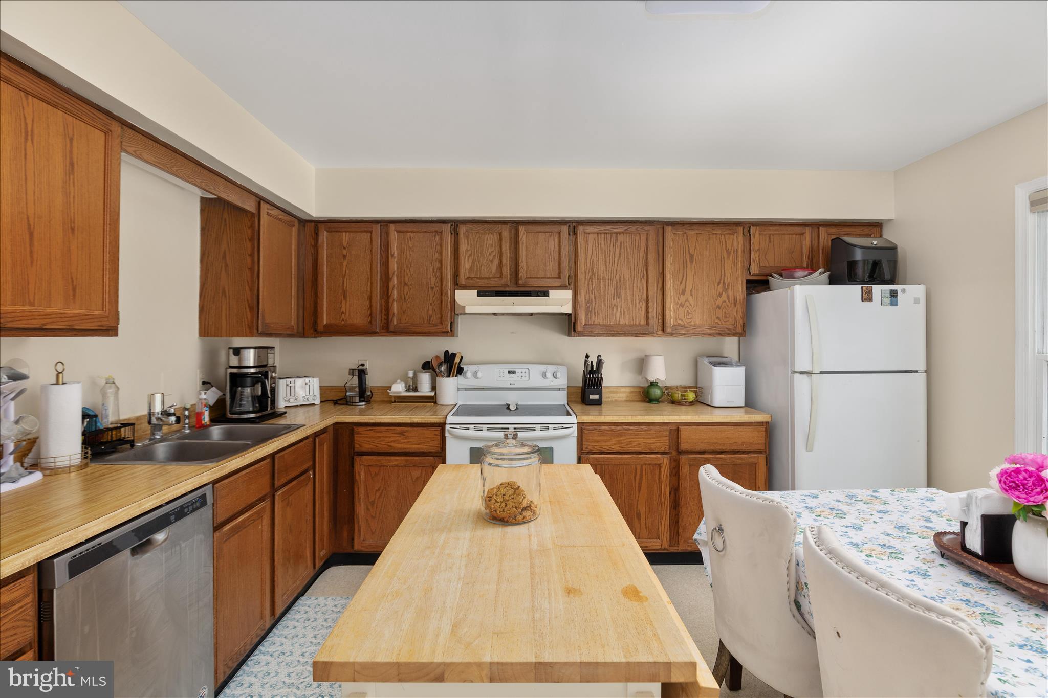 208 North Rappahannock Street Remington, VA 22734 - Photo 7 of 21 a kitchen with kitchen island a sink a stove and refrigerator