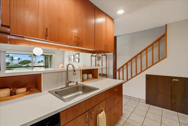 a kitchen with stainless steel appliances granite countertop a sink and a cabinets