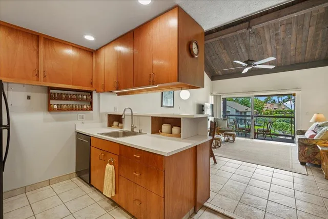 a kitchen with a cabinets and a counter top space