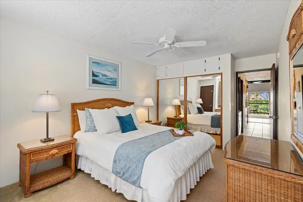 a bedroom with bed and window with lamp