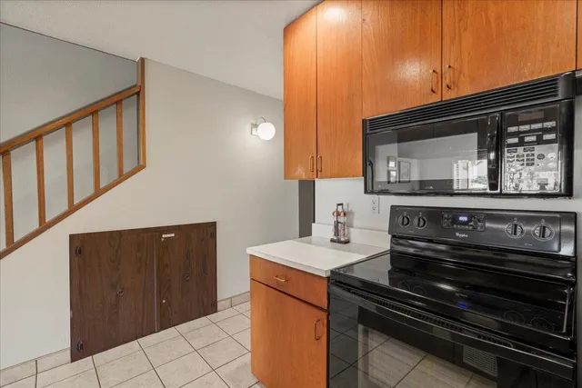 a kitchen that has a sink and a stove