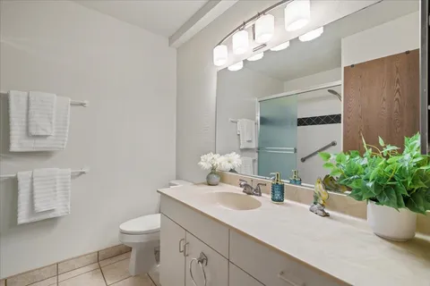 a bathroom with a shower and a mirror