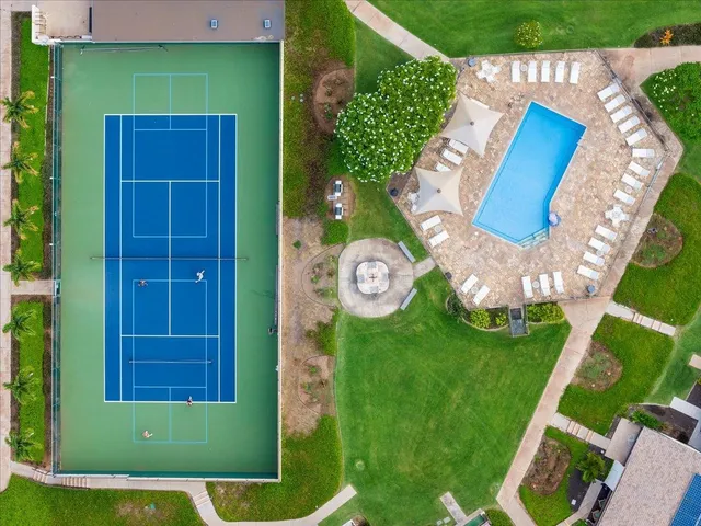 a view of a swimming pool with a patio