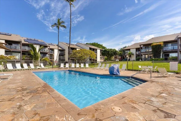 a view of a swimming pool with a patio
