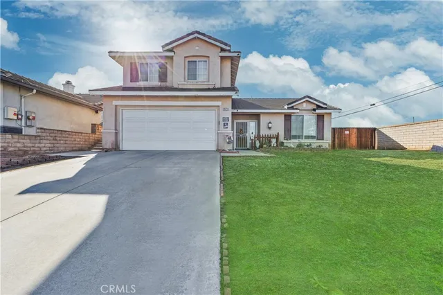 a living room with couches and a flat screen tv