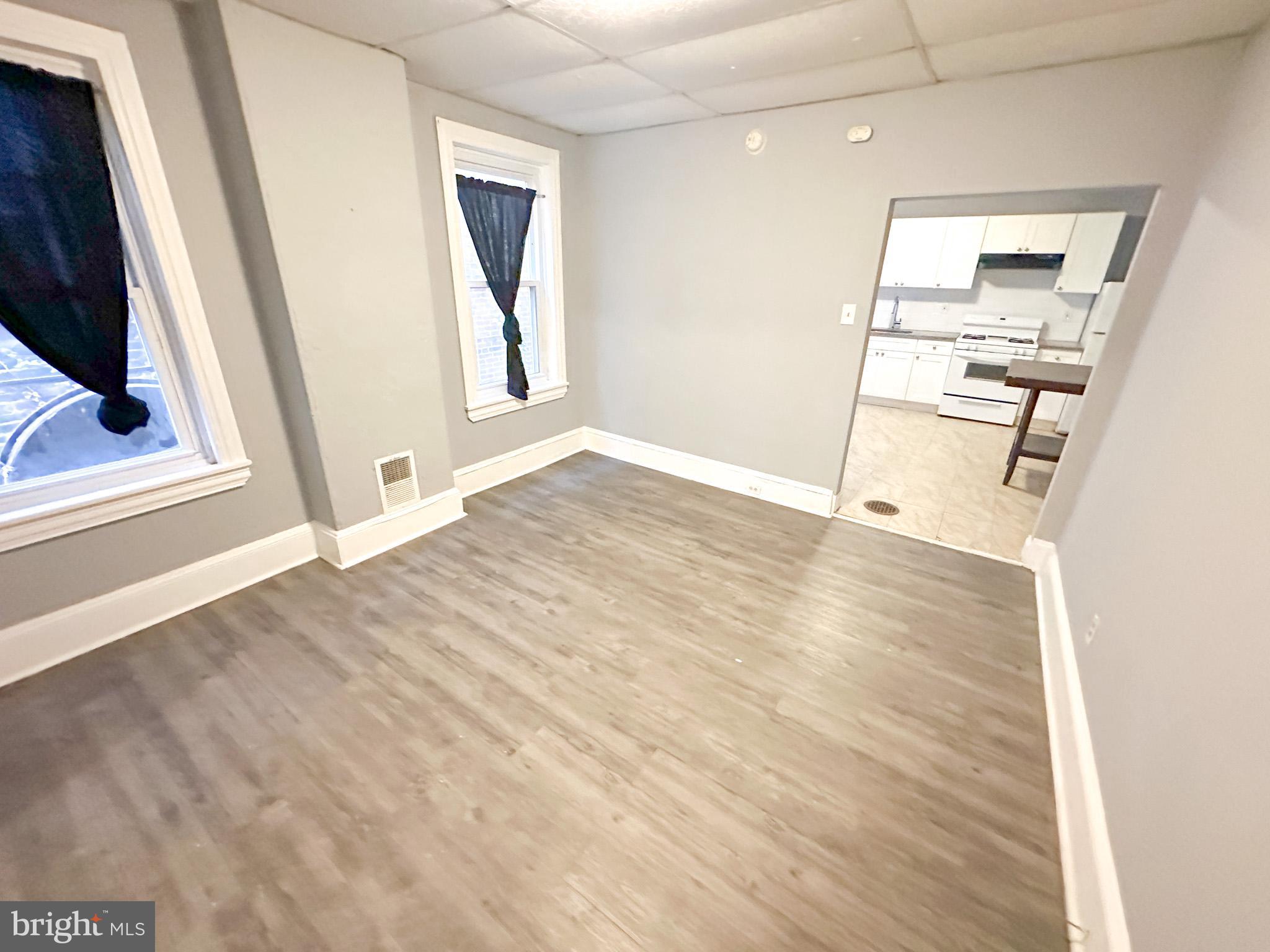 330 North 53rd Street Philadelphia, PA 19139 - Photo 5 of 20 a view of a kitchen with wooden floor and electronic appliances