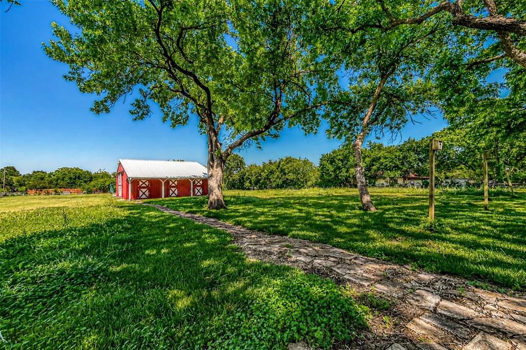 9310 Merritt Road Rowlett, TX 75089 - Photo 28 of 40 a view of a house with a yard