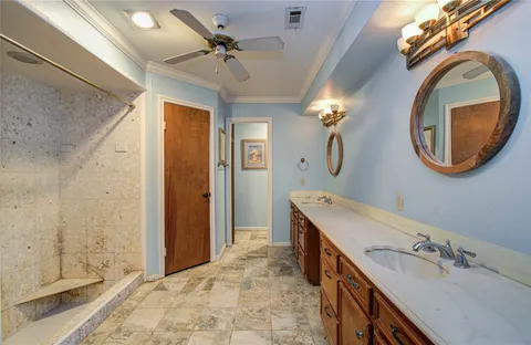 a view of a backyard with a barbeque grill and wooden fence