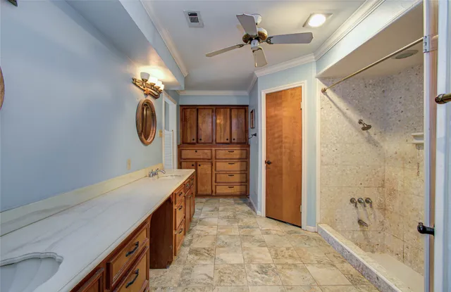 a bathroom with a tub a sink and a shower