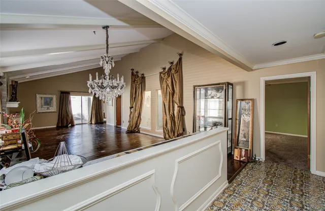 a view of a living room and chandelier