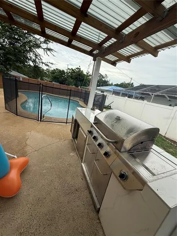 a view of a backyard with table and chairs