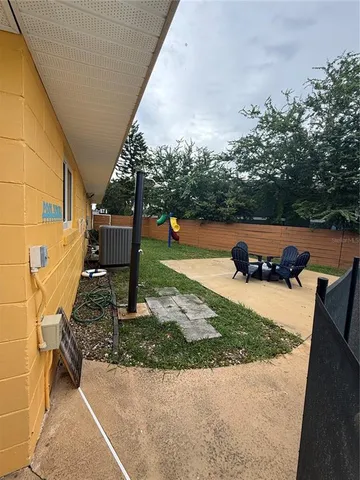 a view of a backyard with sitting area