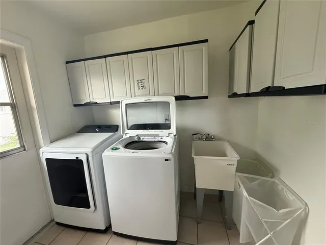 a utility room with dryer and washer