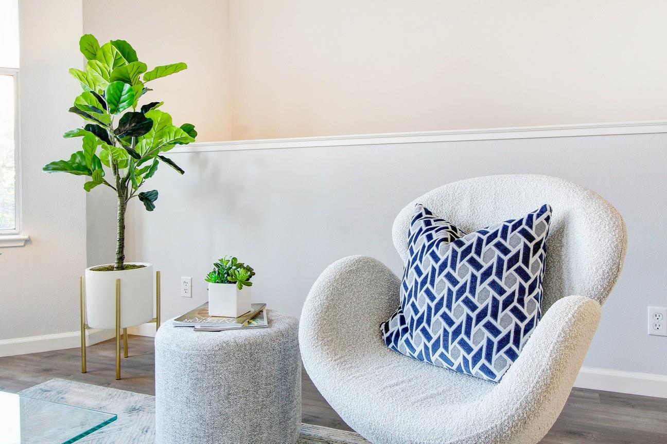 128 Orsi Circle San Francisco, CA 94124 - Photo 12 of 40 a vase of flowers sitting on a table with chairs