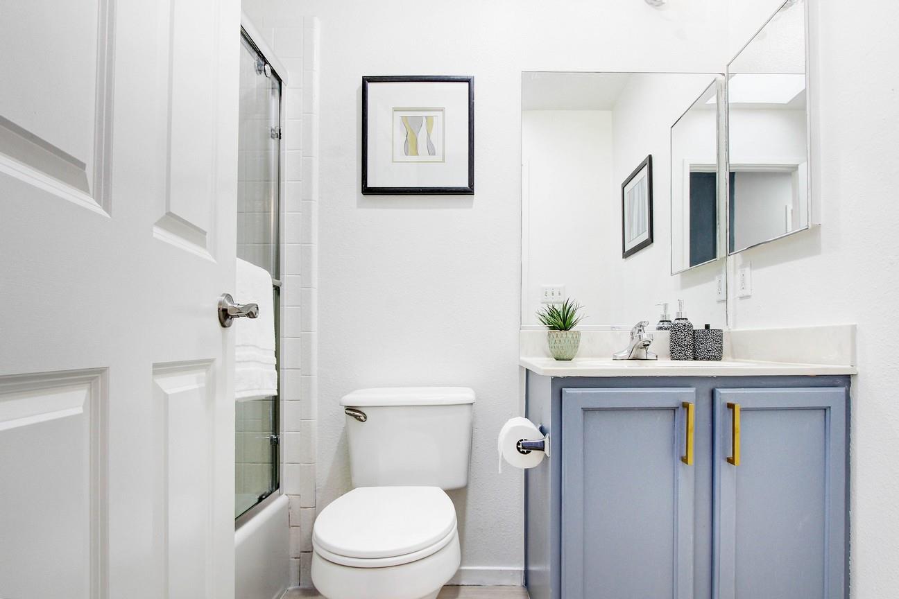 128 Orsi Circle San Francisco, CA 94124 - Photo 20 of 40 a bathroom with a sink a toilet and shower