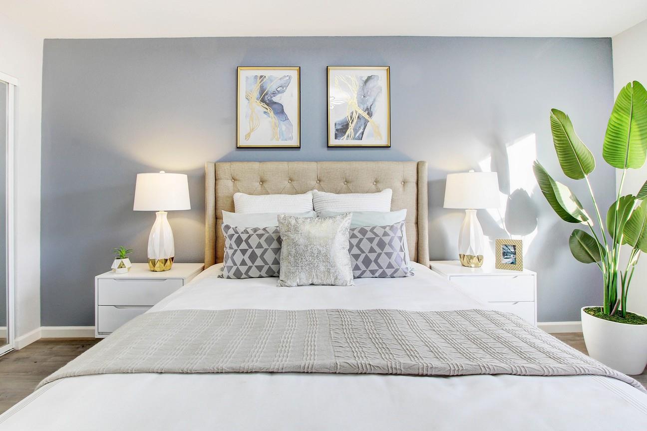 128 Orsi Circle San Francisco, CA 94124 - Photo 22 of 40 a bedroom with a bed and painting on the wall