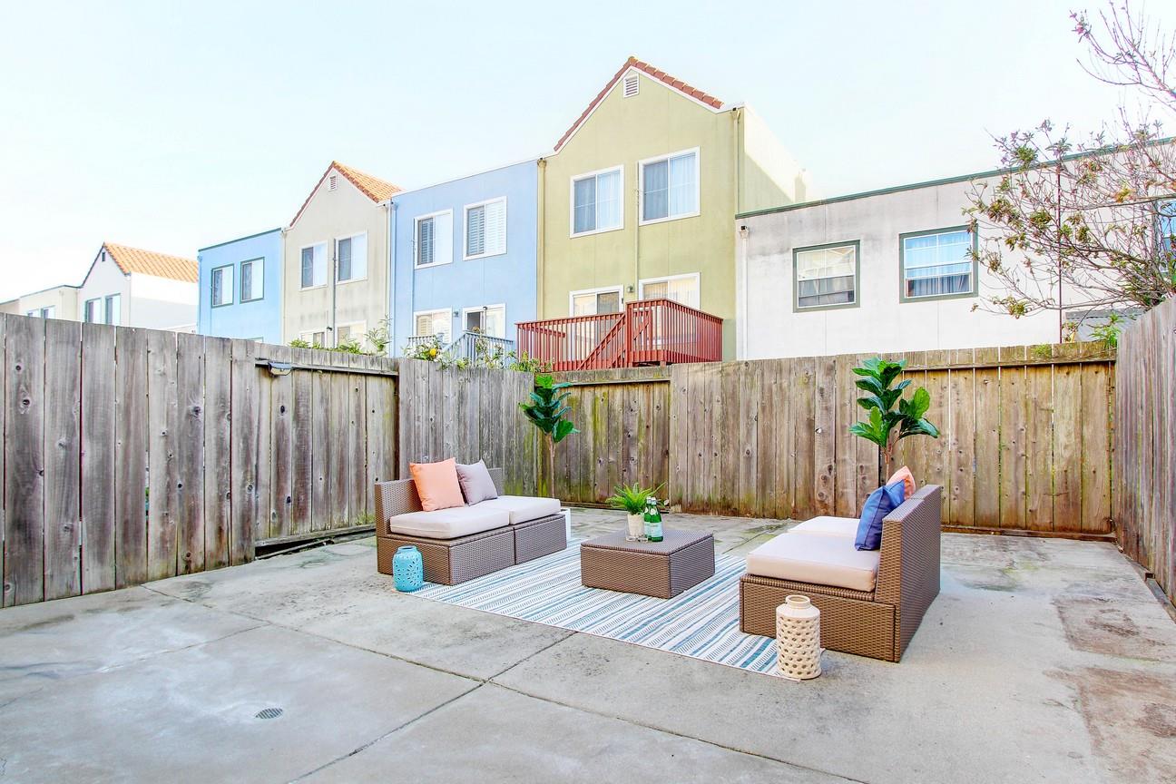 128 Orsi Circle San Francisco, CA 94124 - Photo 32 of 40 a backyard of a house with outdoor seating