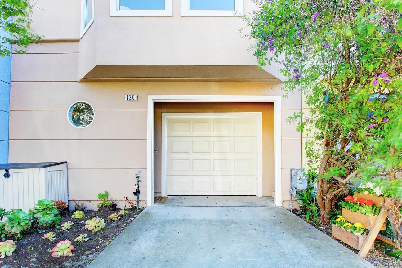 128 Orsi Circle San Francisco, CA 94124 - Photo 5 of 40 a front view of house with flowers