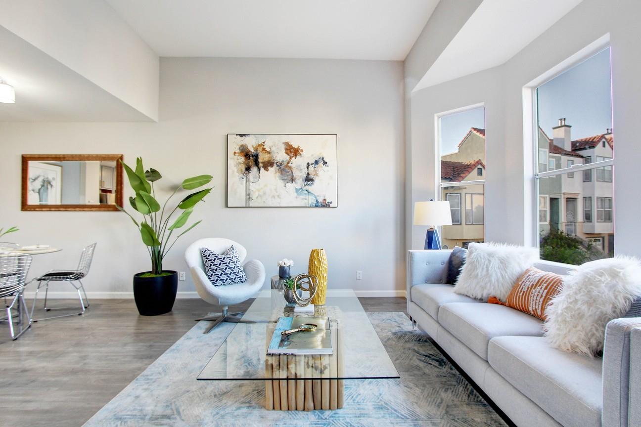 128 Orsi Circle San Francisco, CA 94124 - Photo 7 of 40 a living room with furniture and a potted plant