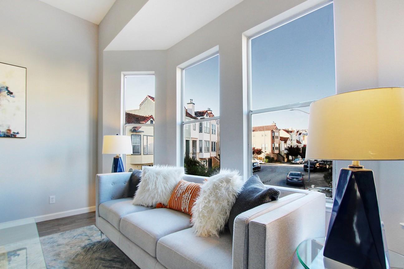 128 Orsi Circle San Francisco, CA 94124 - Photo 9 of 40 a living room with furniture and a flat screen tv