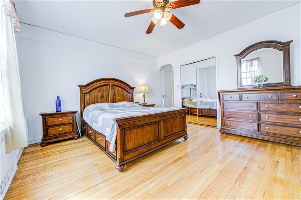 601 79th Street, Unit D11 Brooklyn, NY 11209 - Photo 11 of 19 a bedroom with a bed and a dresser