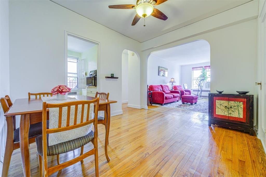 601 79th Street, Unit D11 Brooklyn, NY 11209 - Photo 4 of 19 a living room with furniture and a flat screen tv