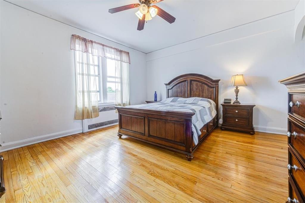 601 79th Street, Unit D11 Brooklyn, NY 11209 - Photo 10 of 19 a bedroom with a bed and a window