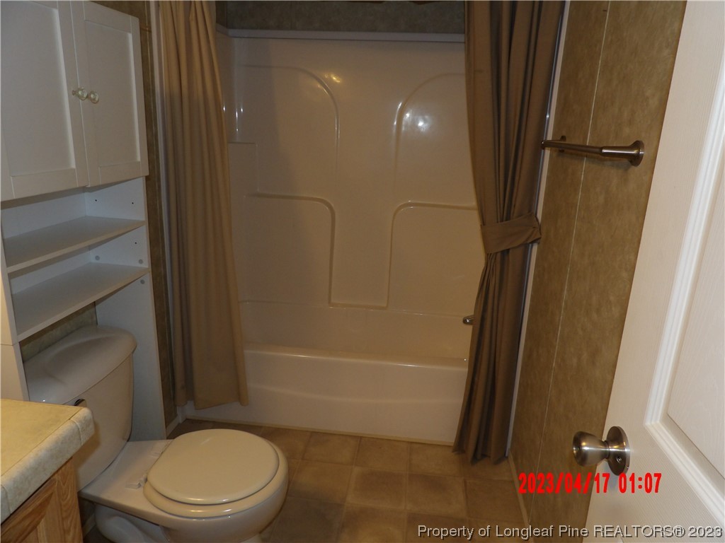 7349 Roslin Farm Road Hope Mills, NC 28348 - Photo 11 of 23 a bathroom with a toilet and a shower