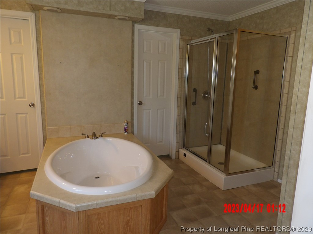 7349 Roslin Farm Road Hope Mills, NC 28348 - Photo 15 of 23 a bathroom with a sink and a shower