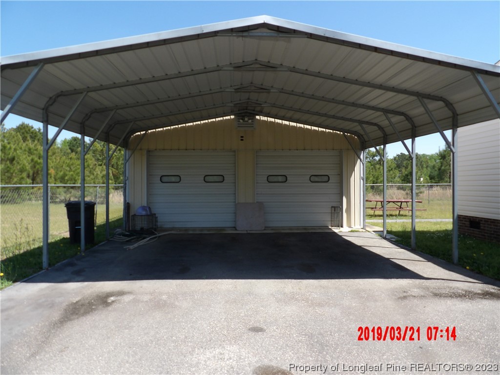 7349 Roslin Farm Road Hope Mills, NC 28348 - Photo 23 of 23 a black car parked in front of a house